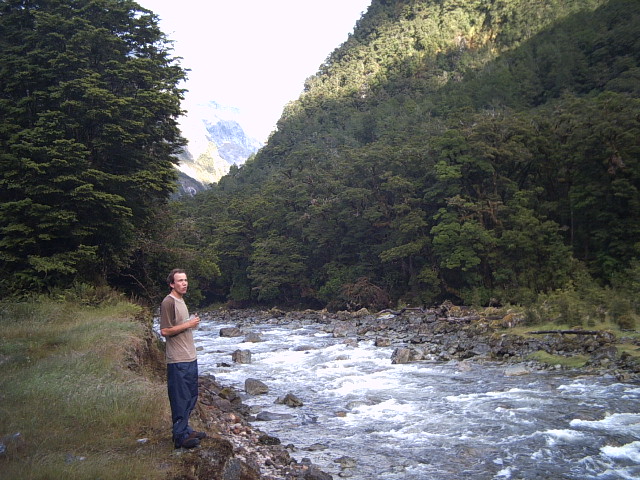milford track rest Resting on the Clinton River on the Milford Track, New Zealand
