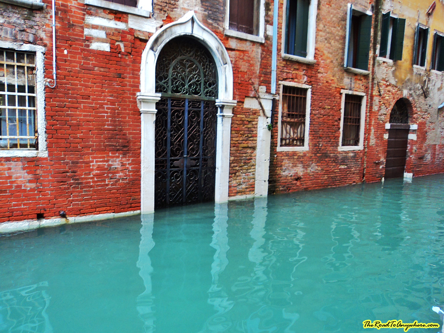 venice flooding door Flooded canal in Venice, italy