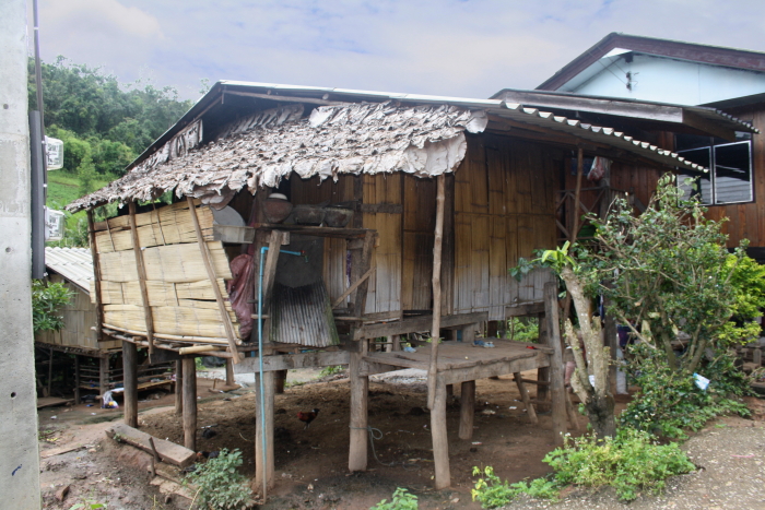 white karen village building A meager house at a White Karen Village in Northern Thailand