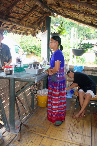 white karen village coffee lady A Lady in a White Karen village in Northern Thailand