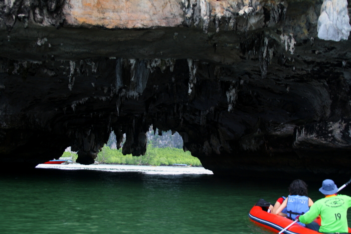 sea canoeing canoe inside cave Sea canoeing in Phang Nga Bay, Thailand