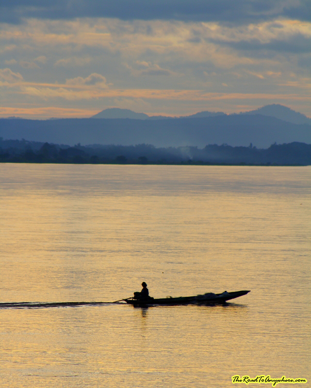 vientiane sunset boat Boat on the Mekong River at Sunset in Vientiane, Laos