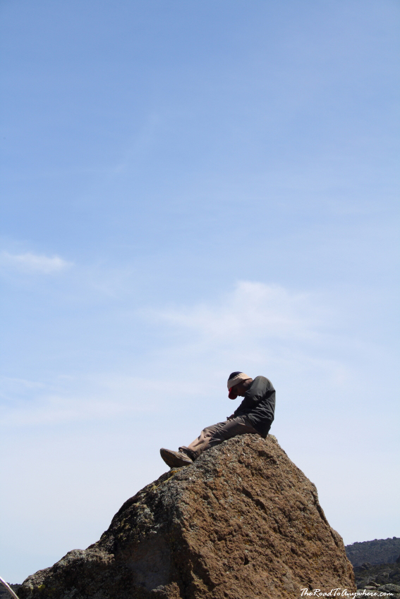 barafu porter resting karanga camp A porter resting on a rock at Karanga Camp on Mount Kilimanjaro, Tanzania