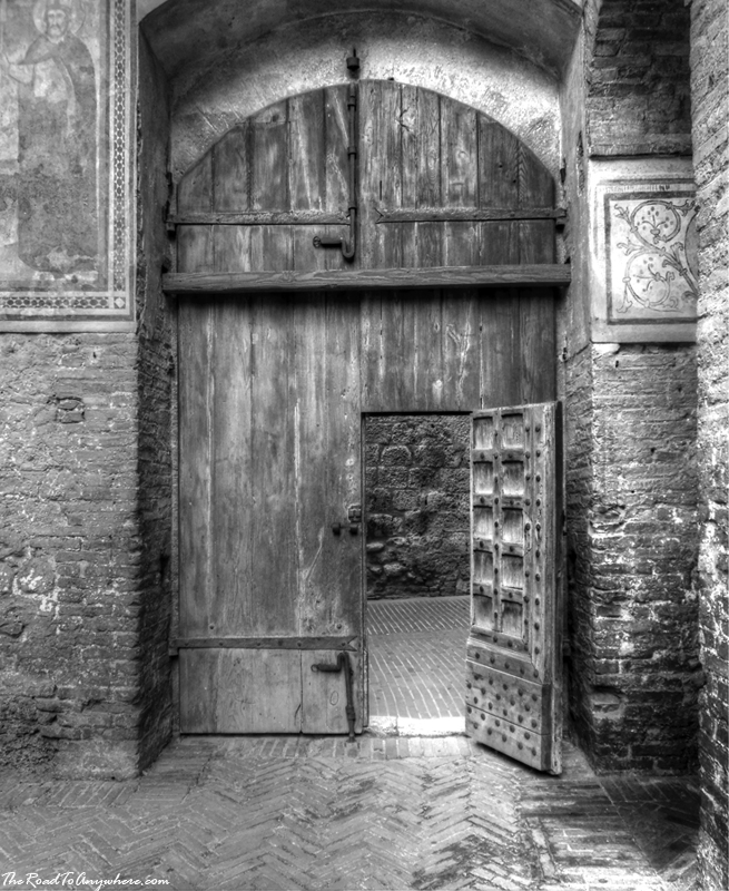 san gimignano wooden door Wooden door in Palazzo Comunale in San Gimignano, Italy