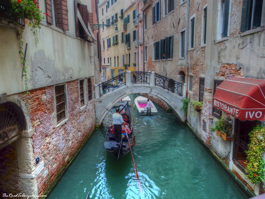 venice canal gondola A gondola in a canal in Venice, Italy