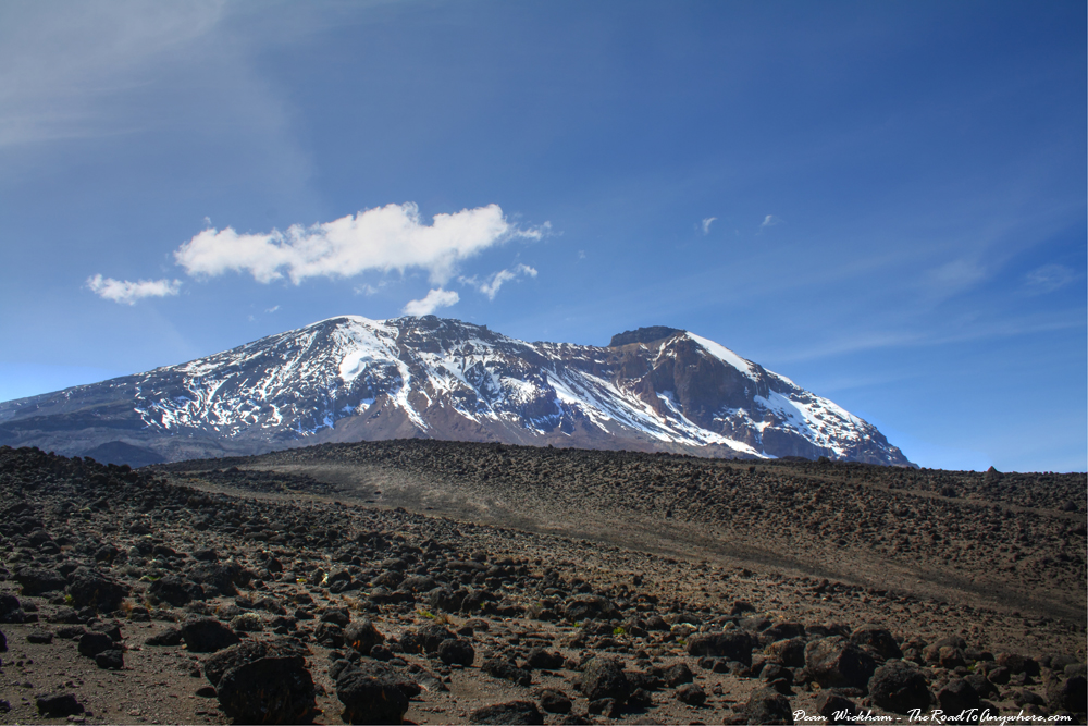 Wide vista of the volcanic alpine desert on the Shira Plateau beneath Kibo Peak